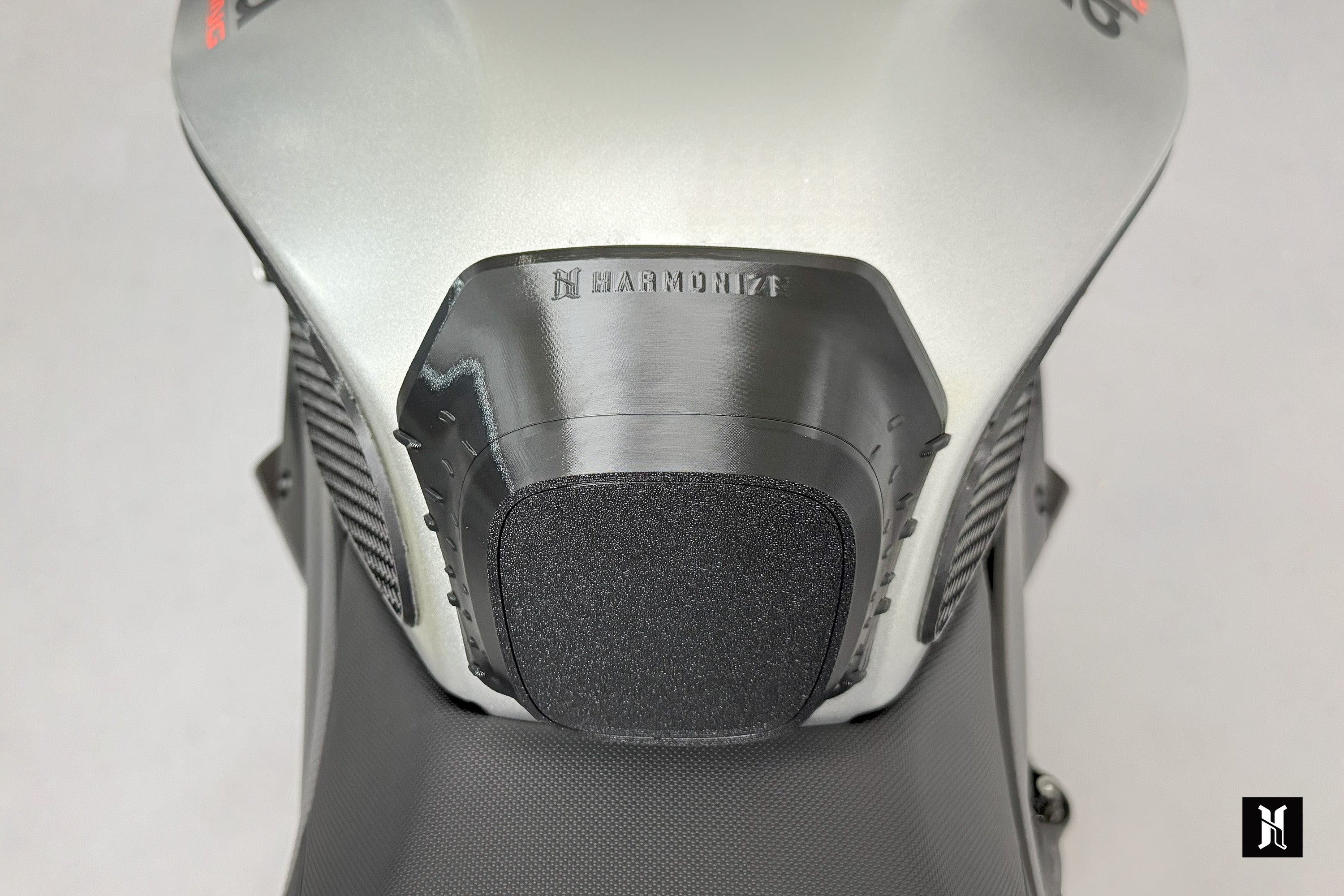 close up of 3D structured tank grip pad showing extension support design for motorcycle performance upgrade and rider control