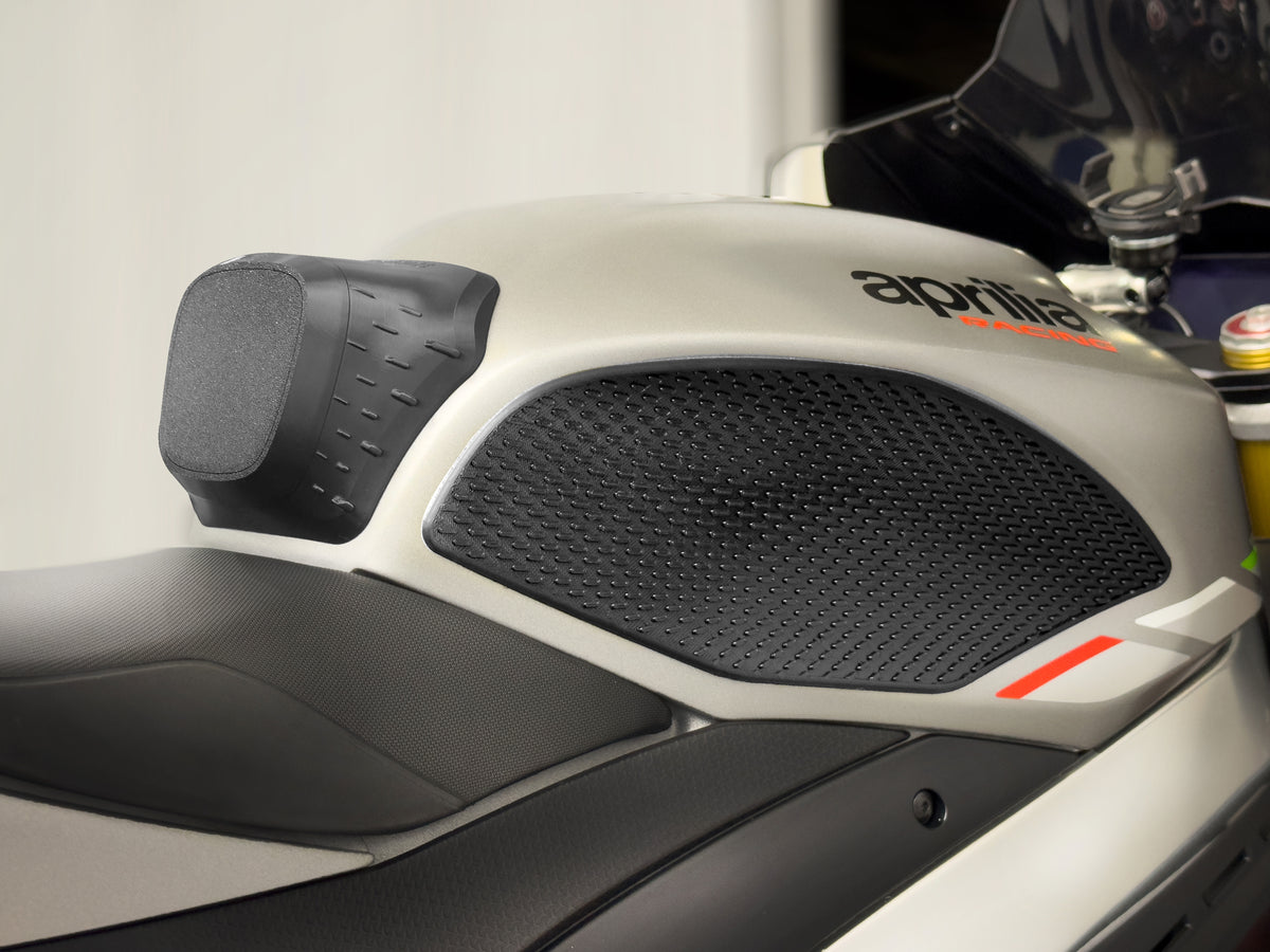 EXT Support System installed on Aprilia RSV4 showing motorcycle tank grip pad and knee grip support positioning on fuel tank