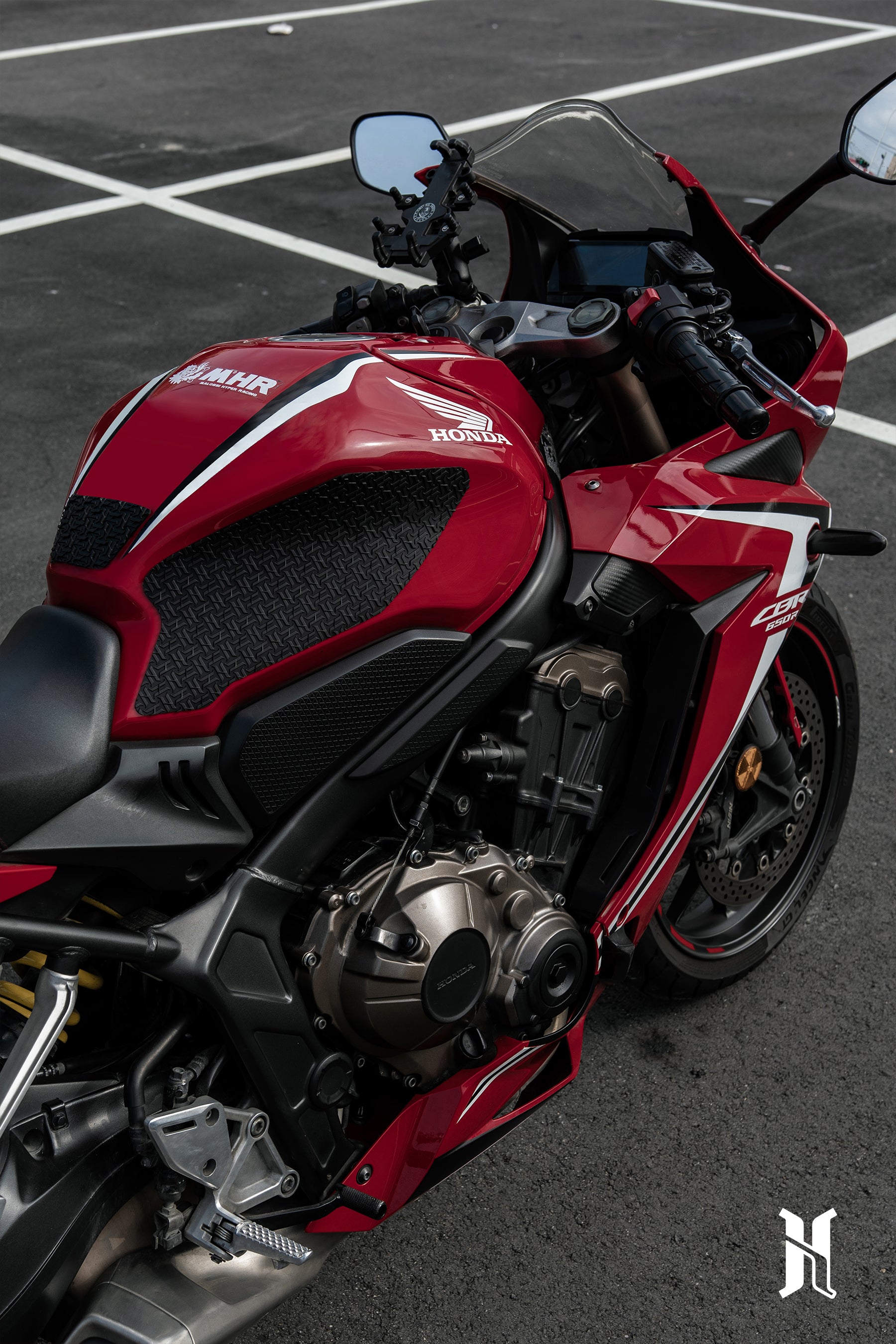 side view of Honda CB650R with HTP tank pads installed showing stylish grip pad integration on fuel tank