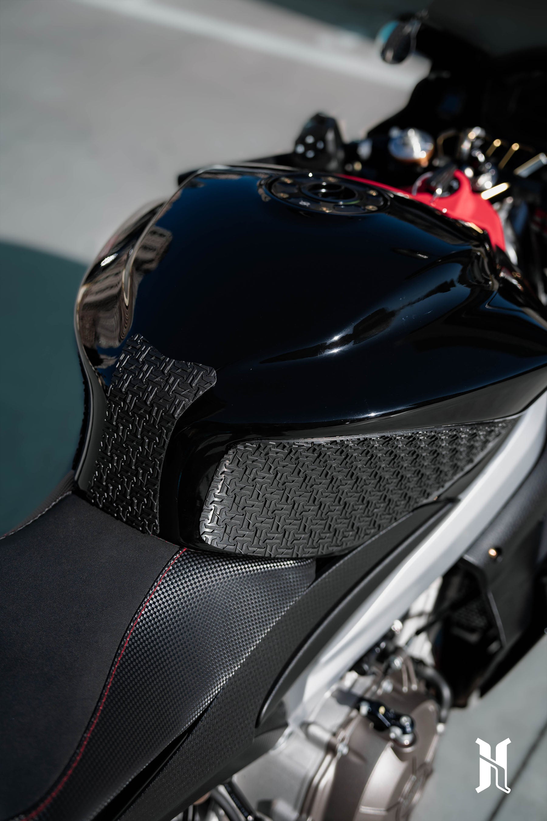 textured grip pattern of HARMONIZE tank pad inspired by MotoGP rider control ergonomics