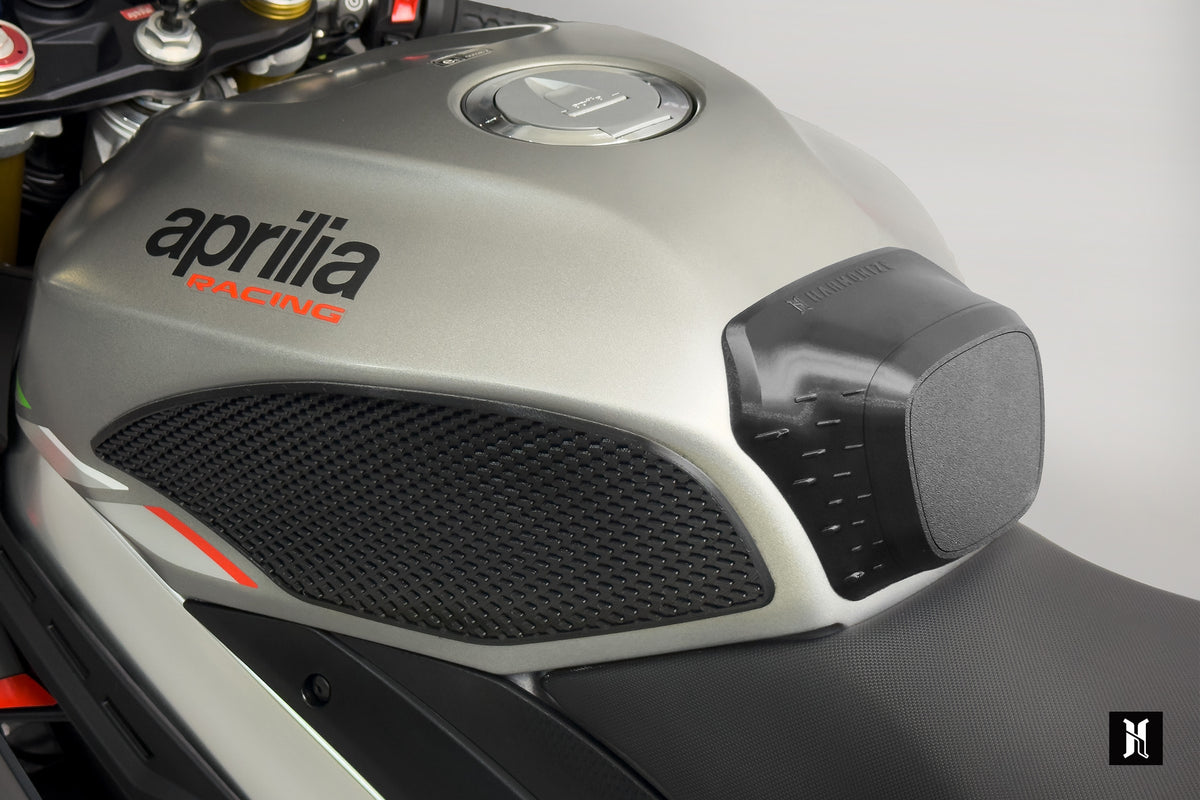 rider knee grip contact with 3D tank grip pad showing ergonomic support and improved riding stability on Aprilia RSV4