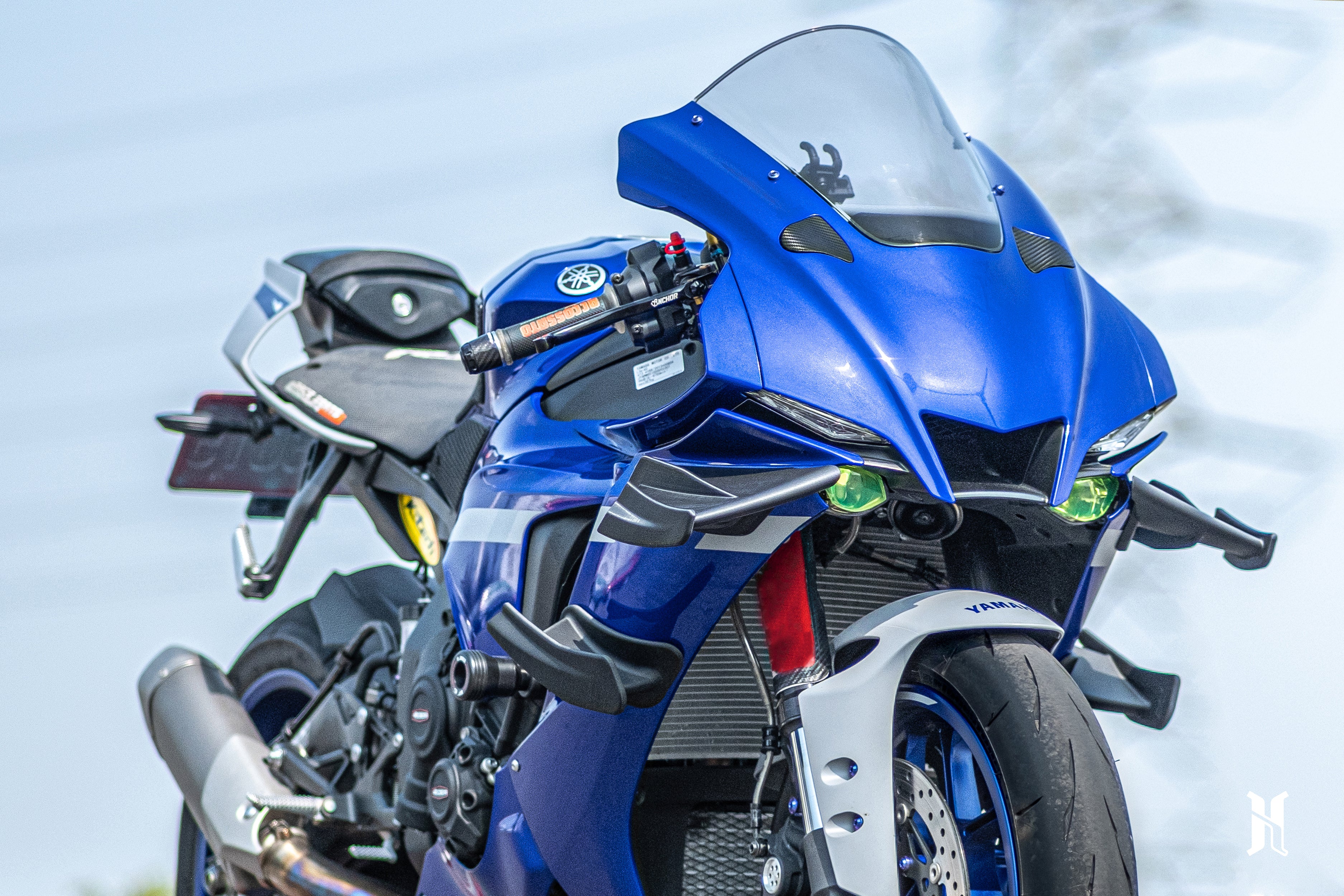 Close-up of carbon fiber reinforced thermoplastic winglet on Yamaha R1 showing MotoGP inspired aerodynamic shaping