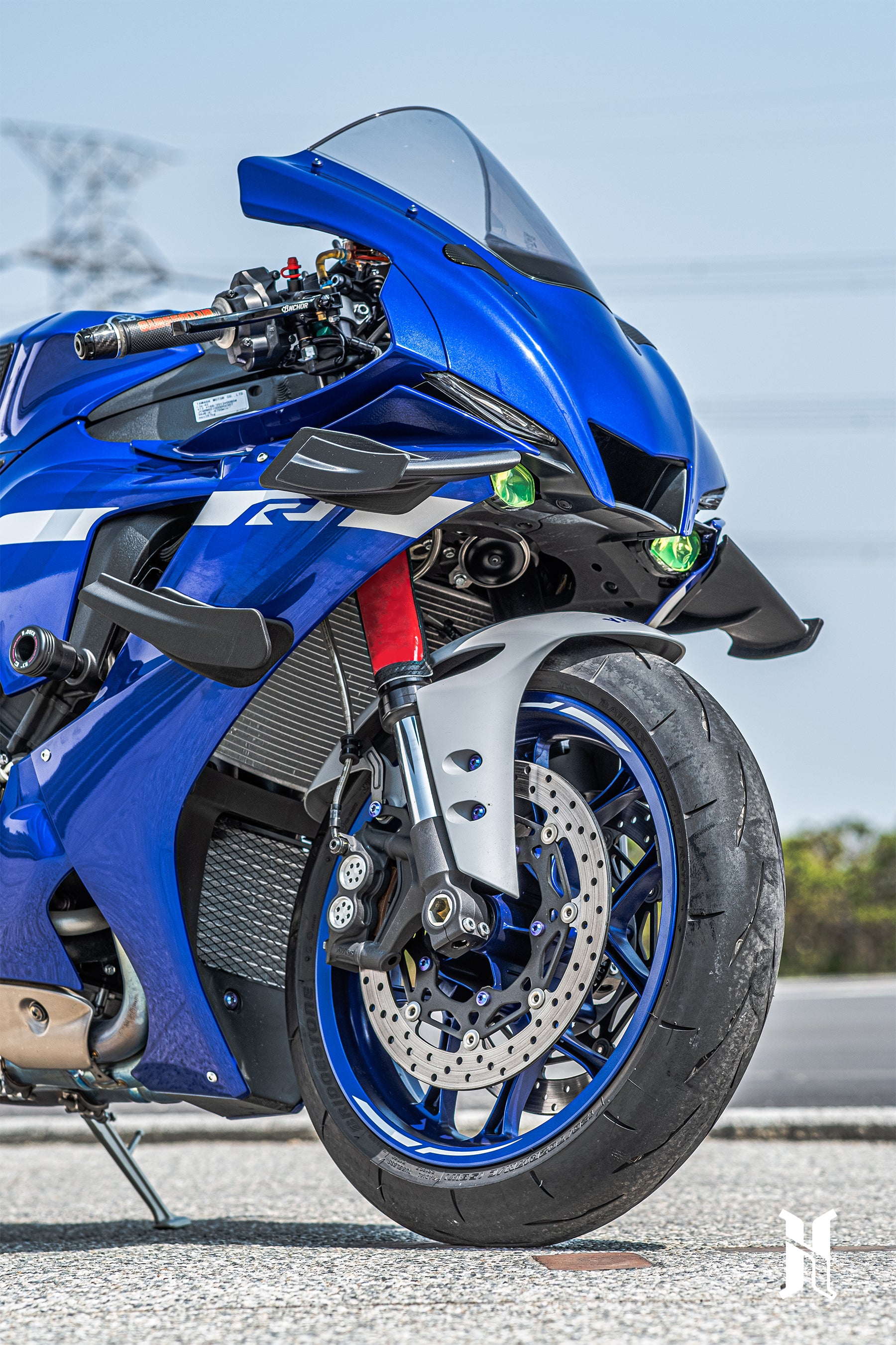 Aerodynamic edge design of HARMONIZE winglet reflecting MotoGP airflow efficiency concepts on Yamaha R1