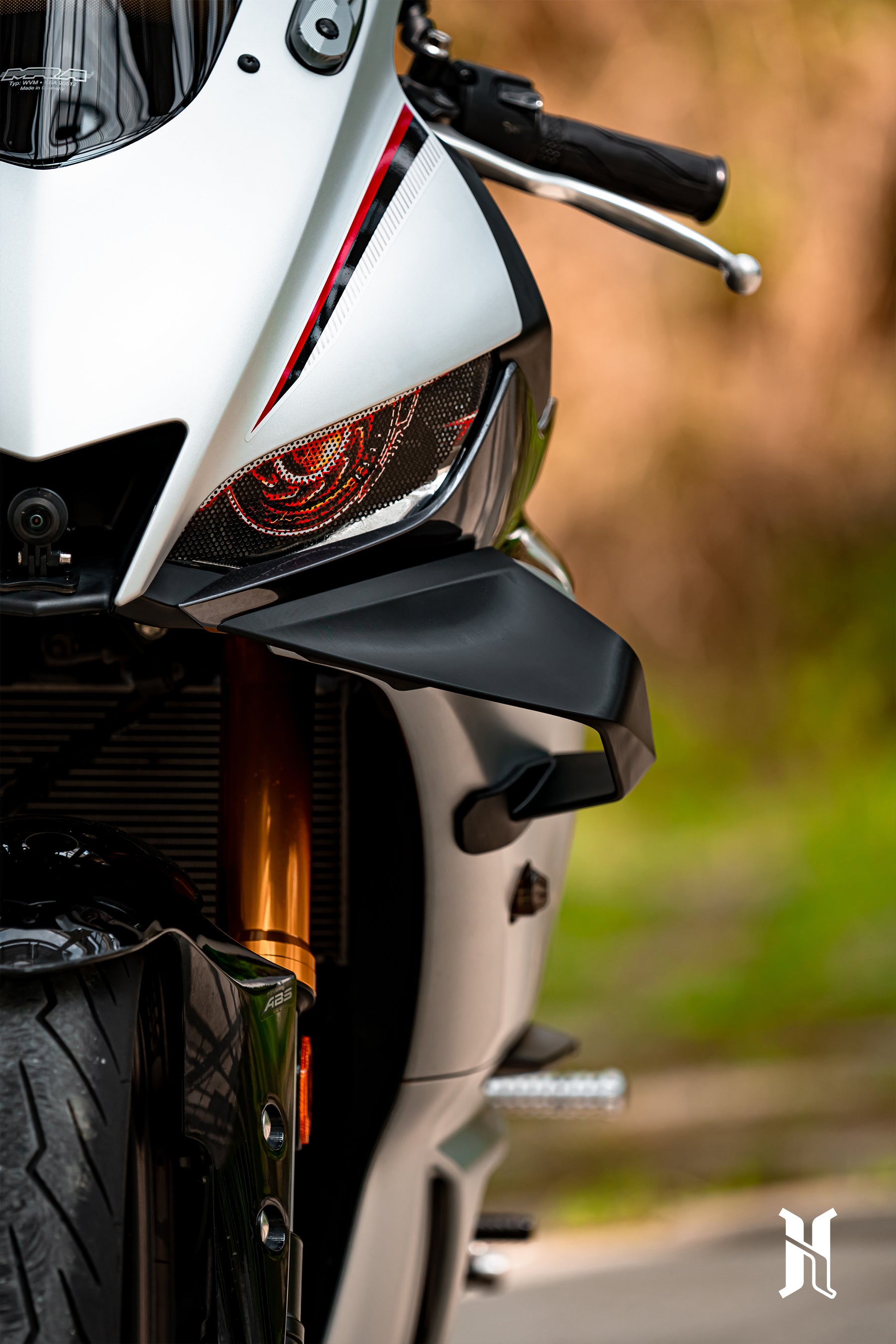Mounting point detail of HARMONIZE winglet designed specifically for 2019–2024 Yamaha R3 fairing
