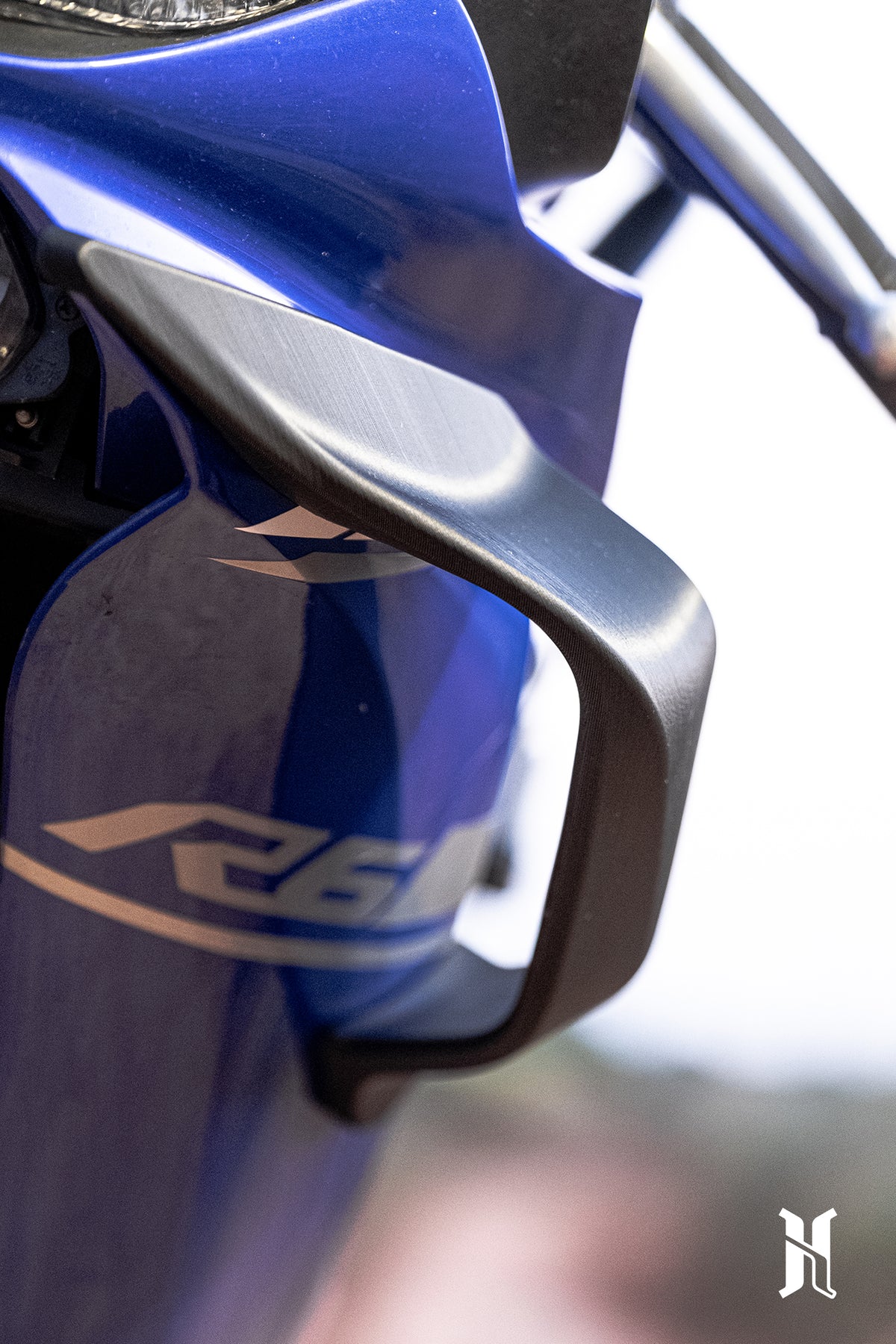Aerodynamic edge design of HARMONIZE winglet optimizing airflow and cornering performance on Yamaha R6
