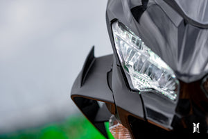 Harmonize aerodynamic winglets for Kawasaki Ninja 400, high-performance winglets for Kawasaki Ninja 400, Kawasaki Ninja 400 racing winglets, aerodynamic upgrades for Kawasaki Ninja 400, Ninja 400 performance upgrades, Ninja 400 racing modifications, Ninja 400 winglets for improved stability and speed, Kawasaki Ninja 400 custom parts