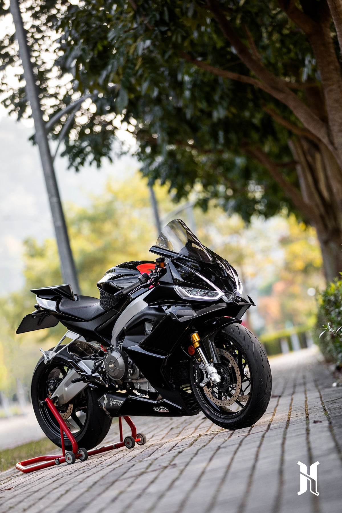 Side view of Aprilia RS660 equipped with aerodynamic winglets, showing seamless integration with fairing design