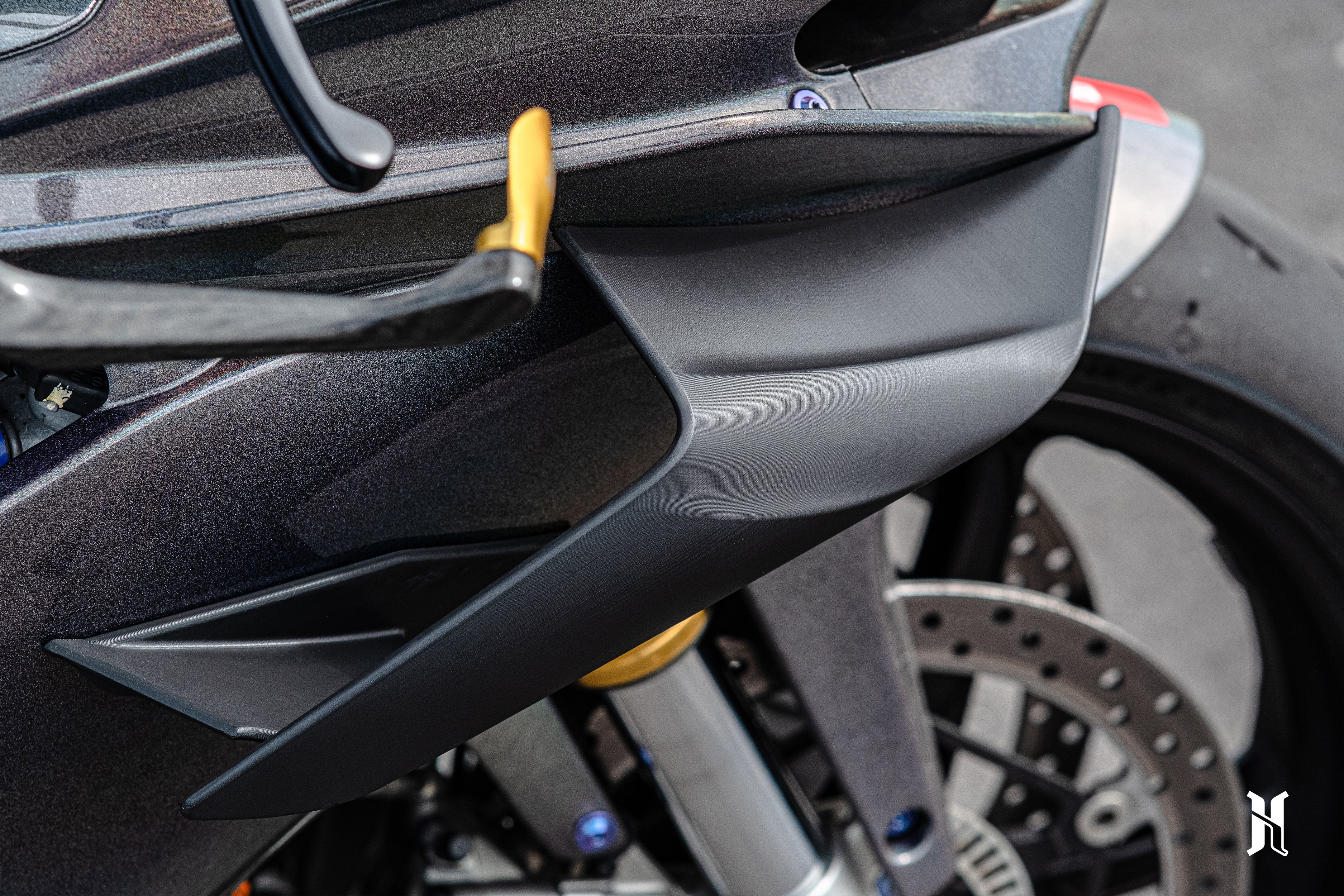 Winglet mounting fitment on Aprilia RSV4 showing clean integration with front fairing