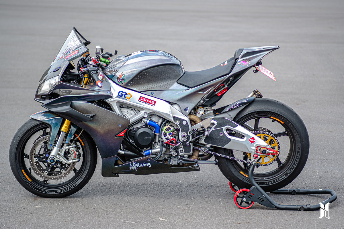 Side profile of Aprilia RSV4 with integrated winglets showing aerodynamic balance and design flow