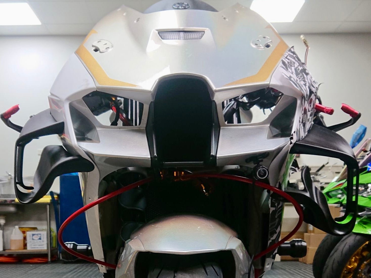 Front-view comparison of early prototype and final HARMONIZE HMZ-ZX10R winglet configuration