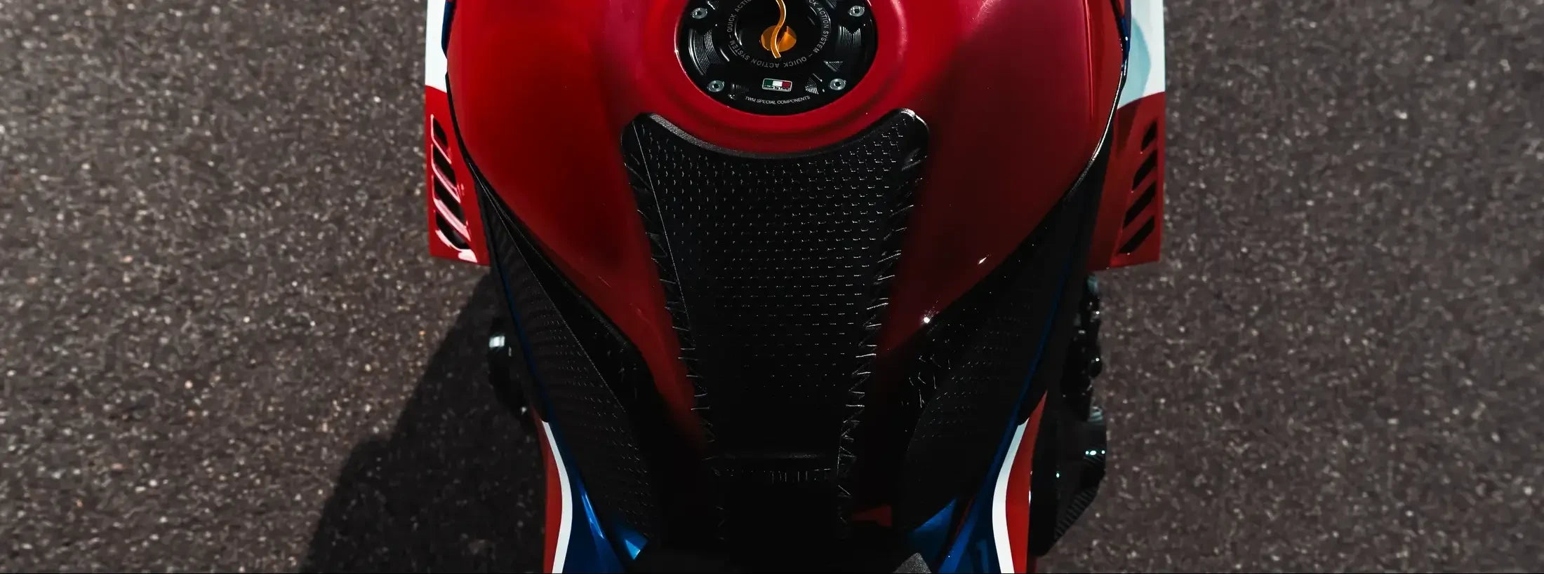 Top-down view showing the EXT-SC82 relationship to the CBR1000RR-R tank geometry